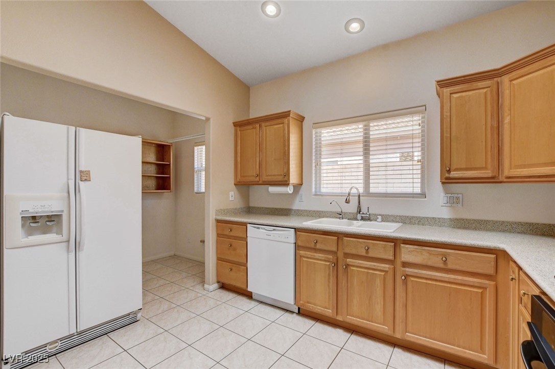 1104 Endora Way Boulder City, NV 89005 - Photo 8 of 36 Kitchen featuring white appliances, open shelves, light tile patterned floors, recessed lighting, and light brown cabinets