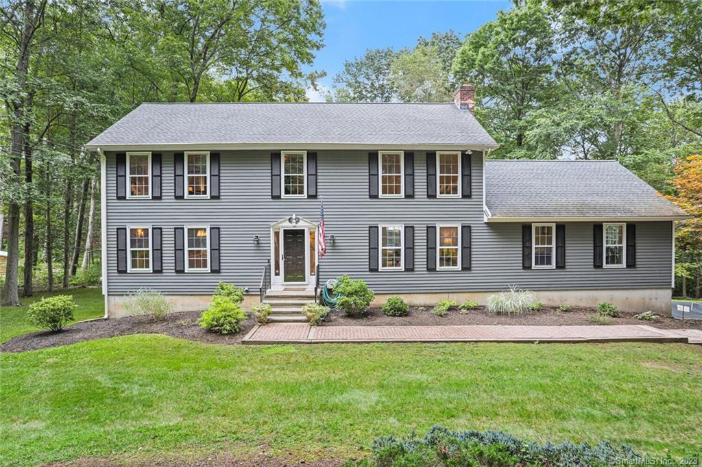 86 Hurd Road Trumbull, CT 06611 - Photo 1 of 1 a front view of a house with a garden and yard