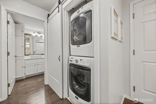 a view of a hallway with washer and dryer