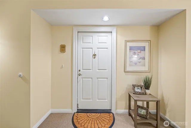 a view of room with furniture and wooden floor