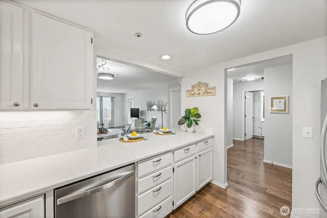 a kitchen with sink and cabinets