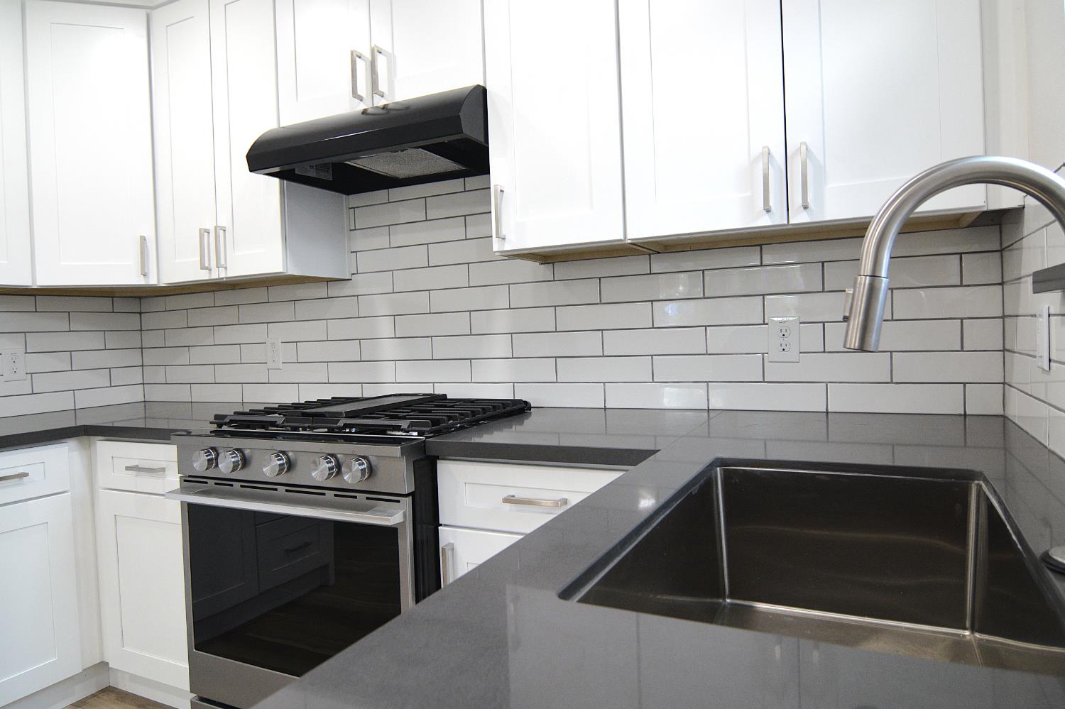7536 Cosgrove Way Sacramento, CA 95822 - Photo 13 of 22 a kitchen with a stove and a sink