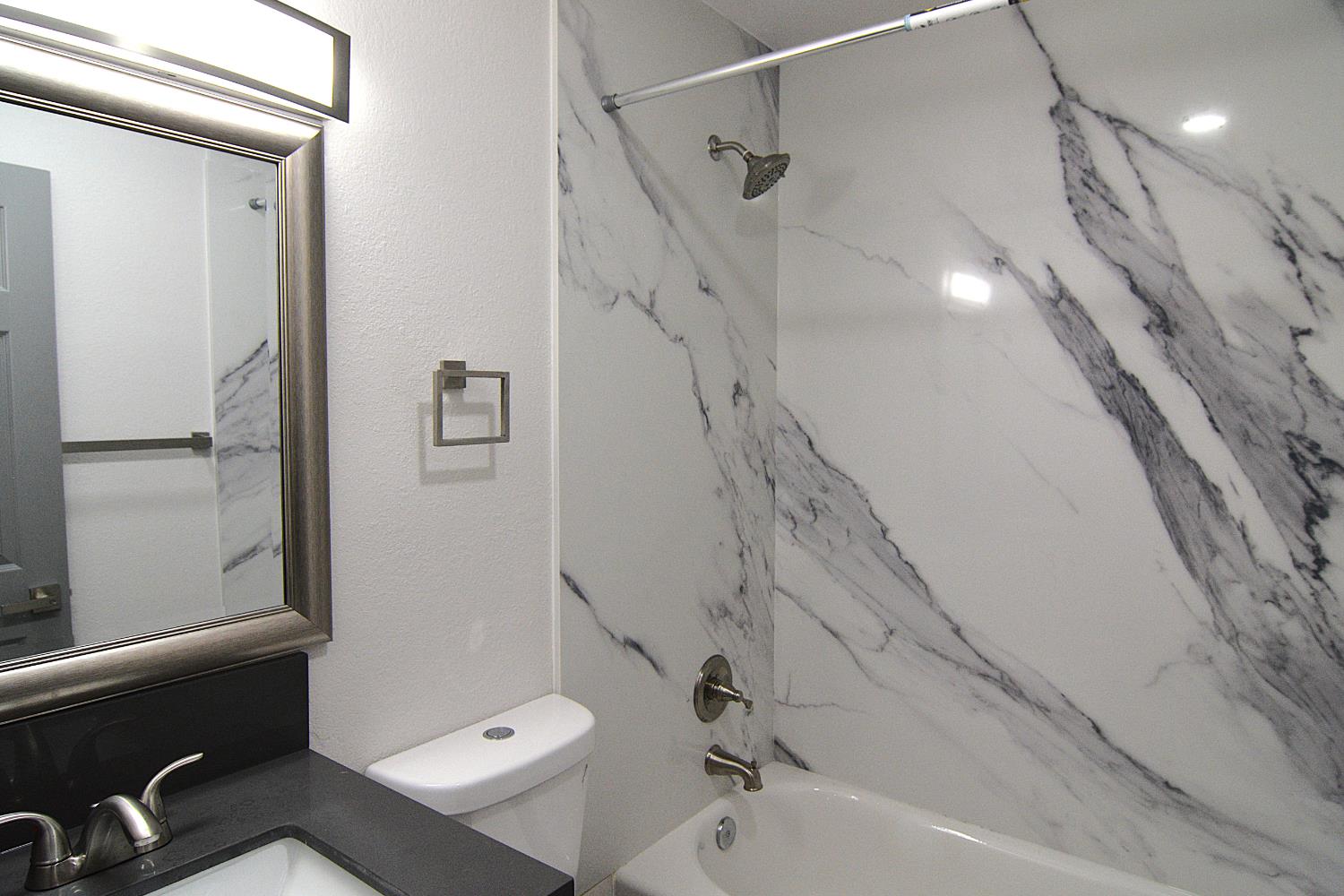 7536 Cosgrove Way Sacramento, CA 95822 - Photo 16 of 22 a bathroom with a shower and a tub