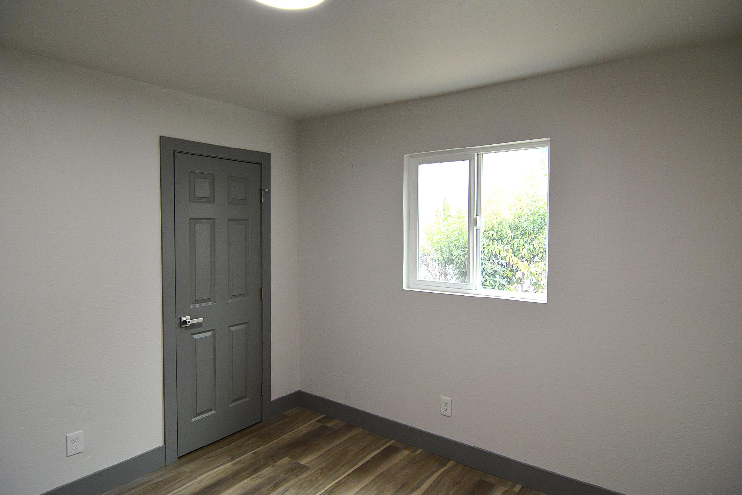 7536 Cosgrove Way Sacramento, CA 95822 - Photo 18 of 22 wooden floor in an empty room with a window