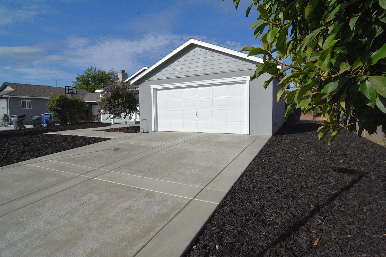 7536 Cosgrove Way Sacramento, CA 95822 - Photo 2 of 22 a front view of a house with a yard and garage