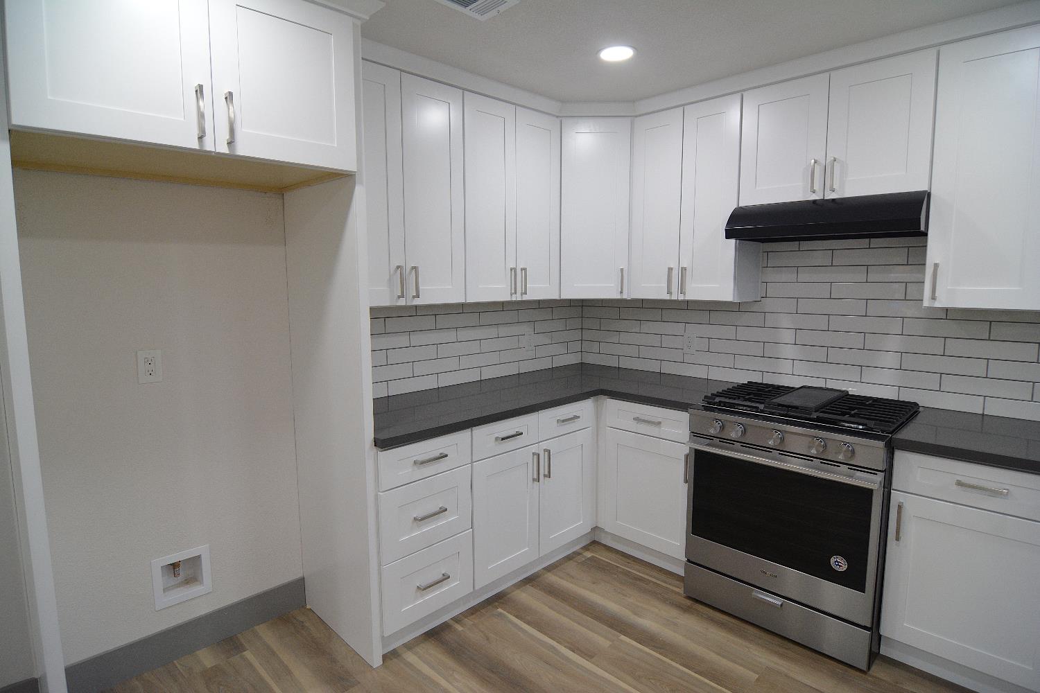 7536 Cosgrove Way Sacramento, CA 95822 - Photo 10 of 22 a kitchen with granite countertop cabinets stainless steel appliances and a sink