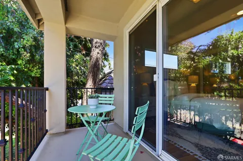 a view of balcony with a patio
