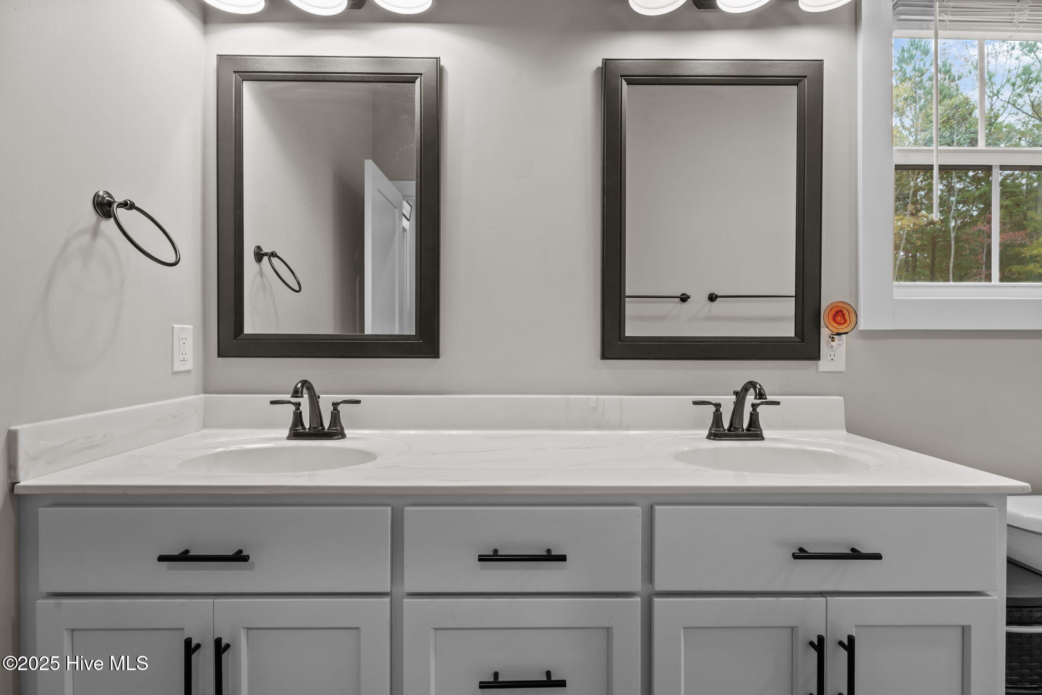 457 Reynolds Road Louisburg, NC 27549 - Photo 17 of 38 Double vanity in the primary suite.