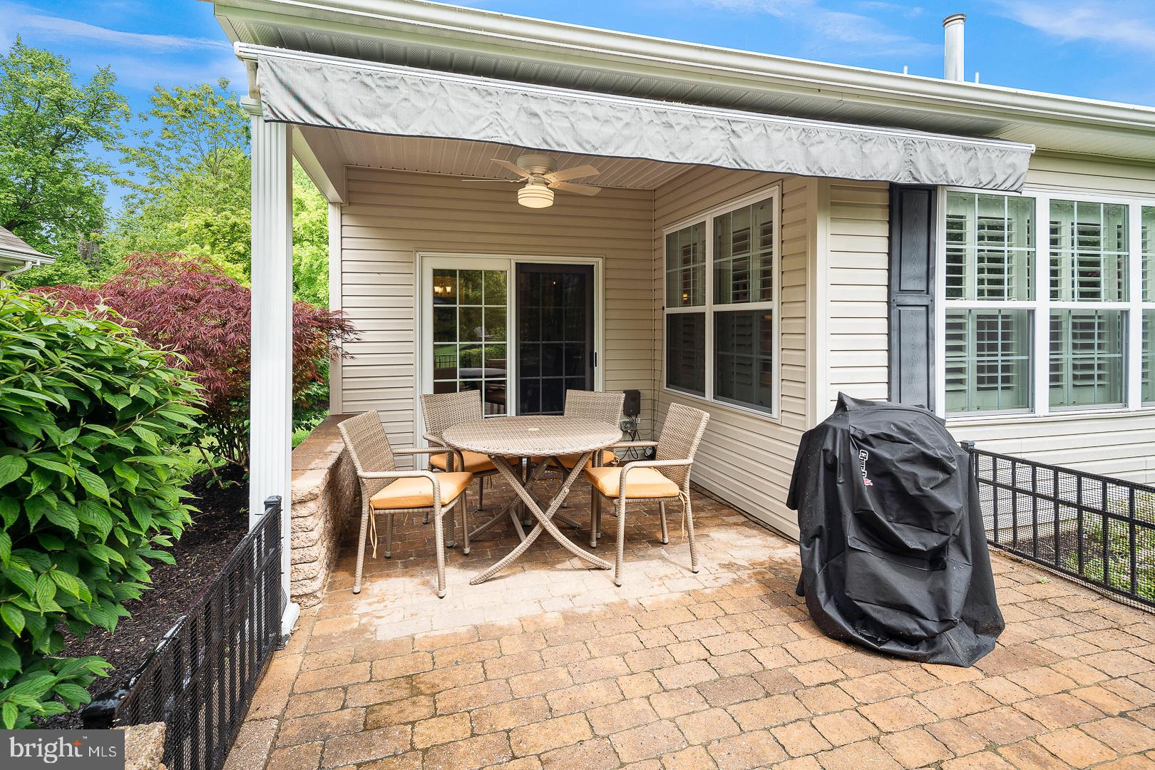 5 York Road Pennington, NJ 08534 - Photo 29 of 31 Stone patio with electric awning