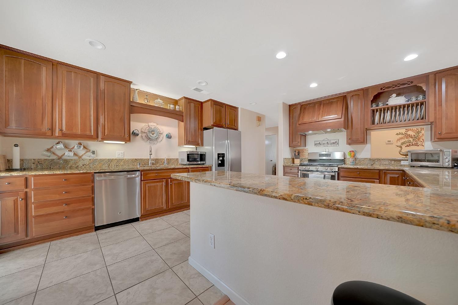 21835 Homestead Road Pine Grove, CA 95665 - Photo 1 of 1 a kitchen with a sink a counter top space and cabinets