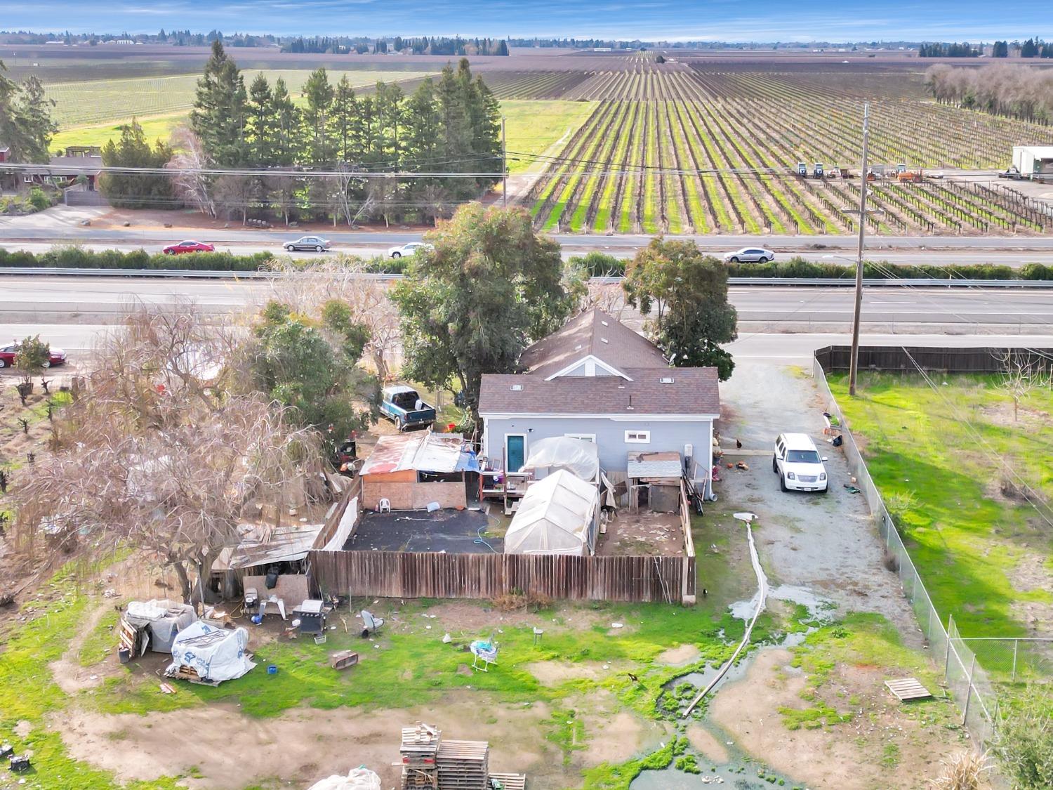 20388 Highway 99 Acampo, CA 95220 - Photo 20 of 24 a view of a house with a yard balcony and sitting area