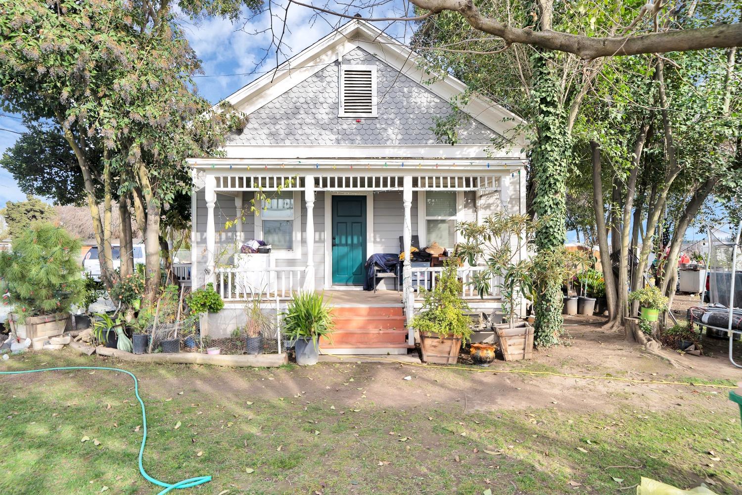 20388 Highway 99 Acampo, CA 95220 - Photo 3 of 24 front view of a house with a patio
