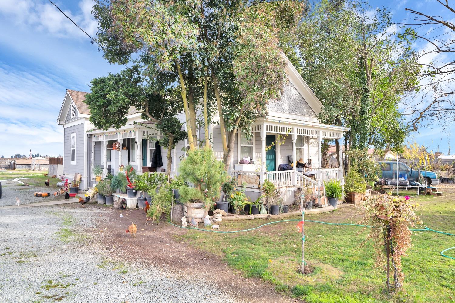 20388 Highway 99 Acampo, CA 95220 - Photo 5 of 24 a view of house with yard and sitting area