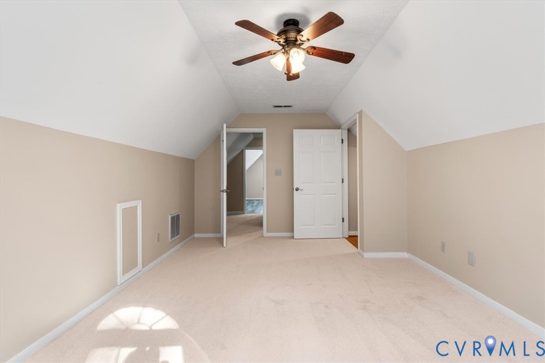 1437 Palmore Road Powhatan, VA 23139 - Photo 40 of 60 Carpeted room with a sloped ceiling and a ceiling