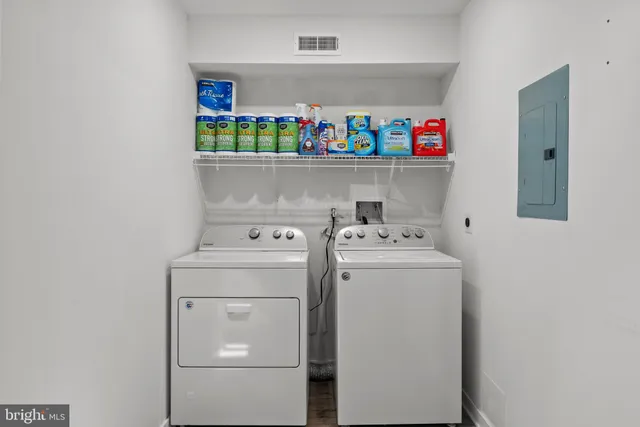 a utility room with dryer and washer