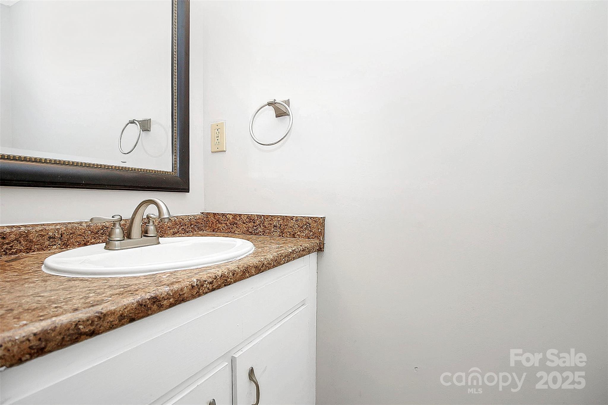 11111 Park Road Charlotte, NC 28226 - Photo 12 of 20 a bathroom with a granite countertop sink and a mirror