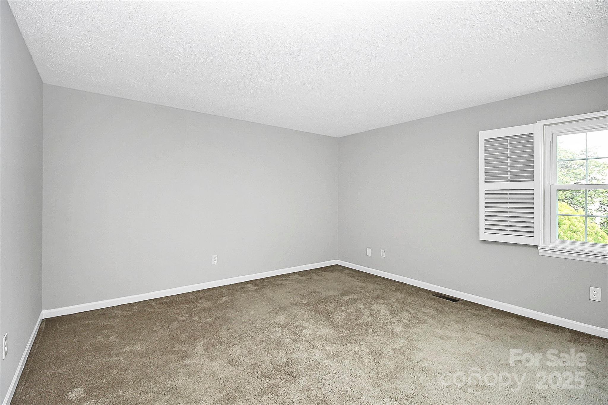 11111 Park Road Charlotte, NC 28226 - Photo 13 of 20 an empty room with a window