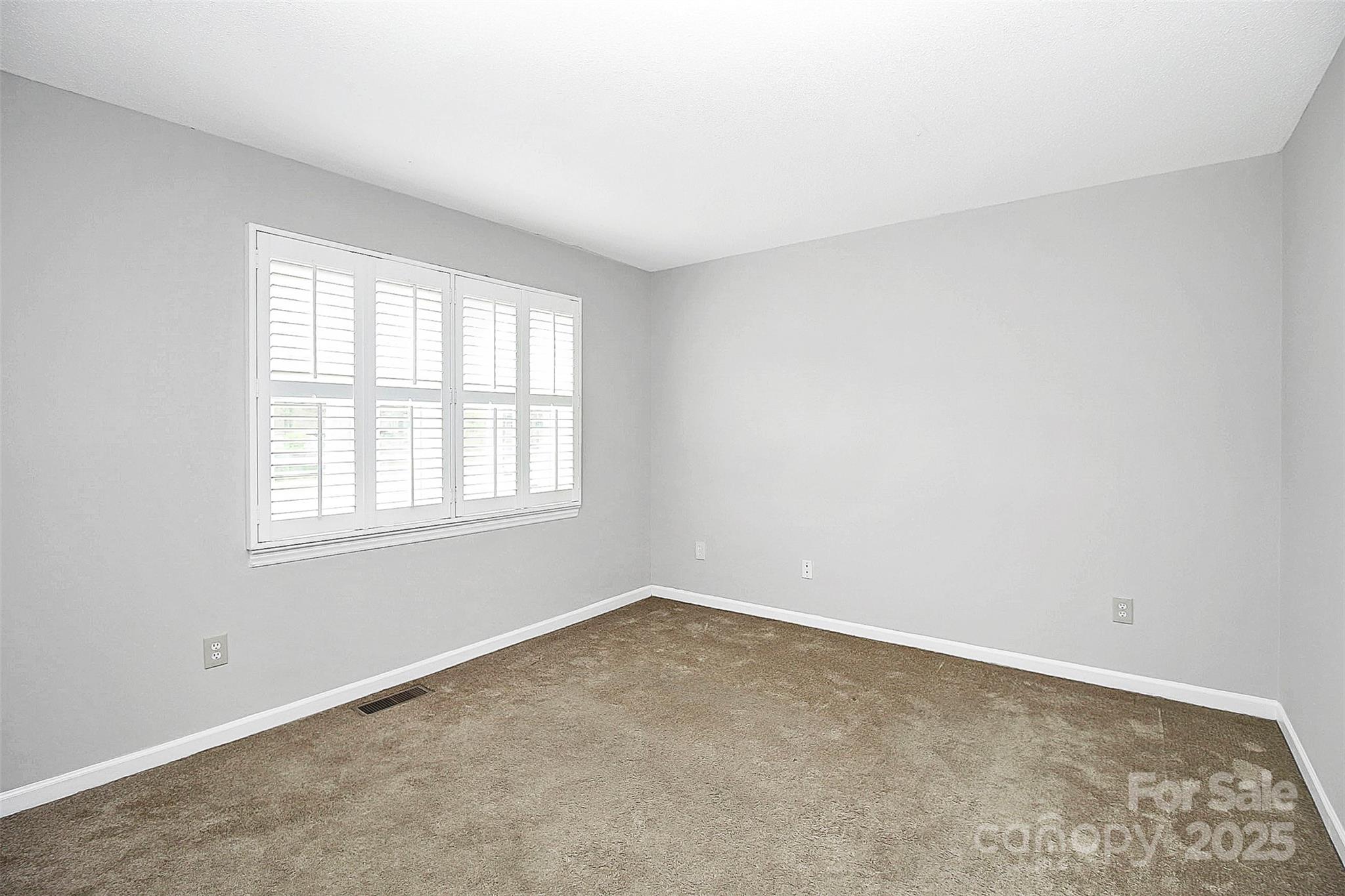 11111 Park Road Charlotte, NC 28226 - Photo 18 of 20 an empty room with a window