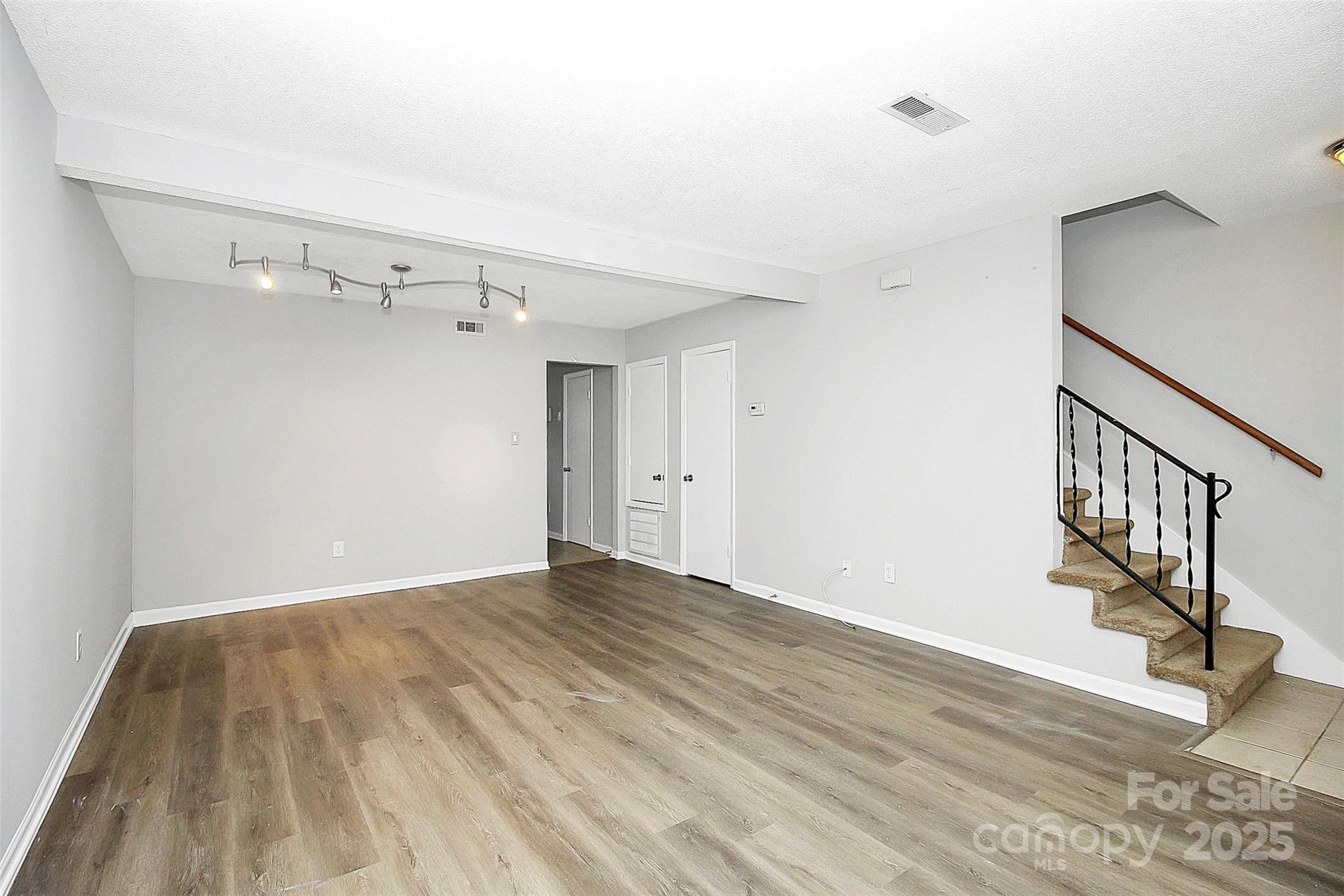 11111 Park Road Charlotte, NC 28226 - Photo 4 of 20 a view of empty room with wooden floor