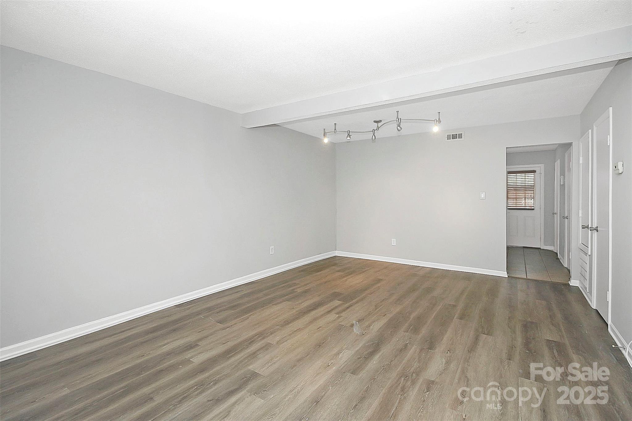 11111 Park Road Charlotte, NC 28226 - Photo 5 of 20 a view of a room with wooden floor