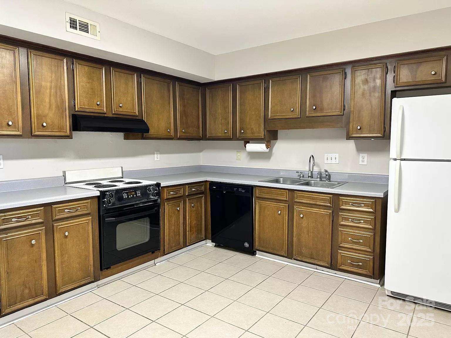11111 Park Road Charlotte, NC 28226 - Photo 7 of 20 a kitchen with stainless steel appliances granite countertop a stove a sink dishwasher and a refrigerator