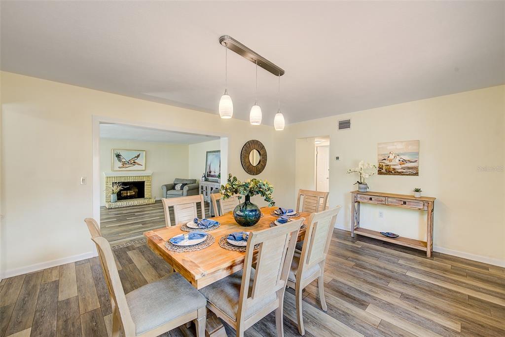 14079 Victoria Road Largo, FL 33774 - Photo 8 of 46 a view of a dining room with furniture window and wooden floor