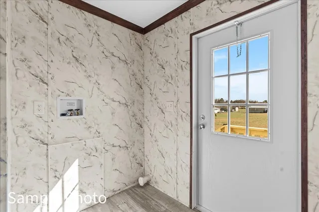 a view of an empty room with a window