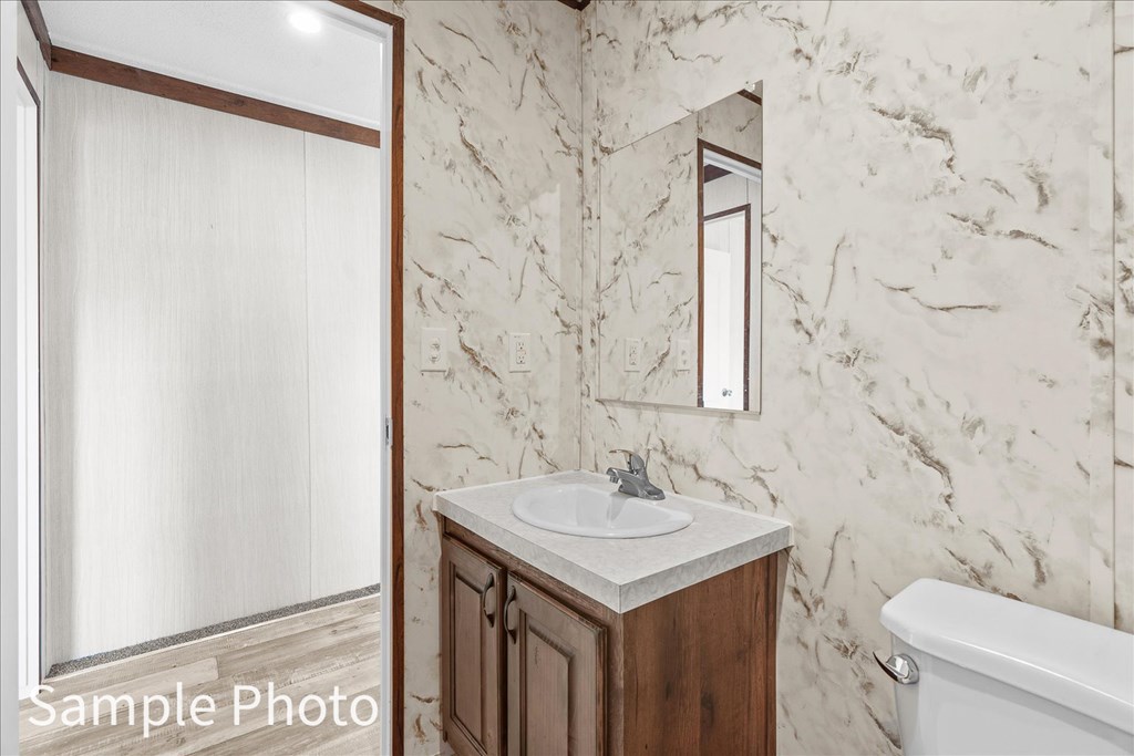 232 Brandon Circle Chatsworth, GA 30705 - Photo 16 of 37 a bathroom with a sink and a toilet