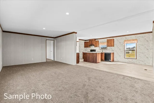 a large kitchen with stainless steel appliances granite countertop a sink and a stove top oven