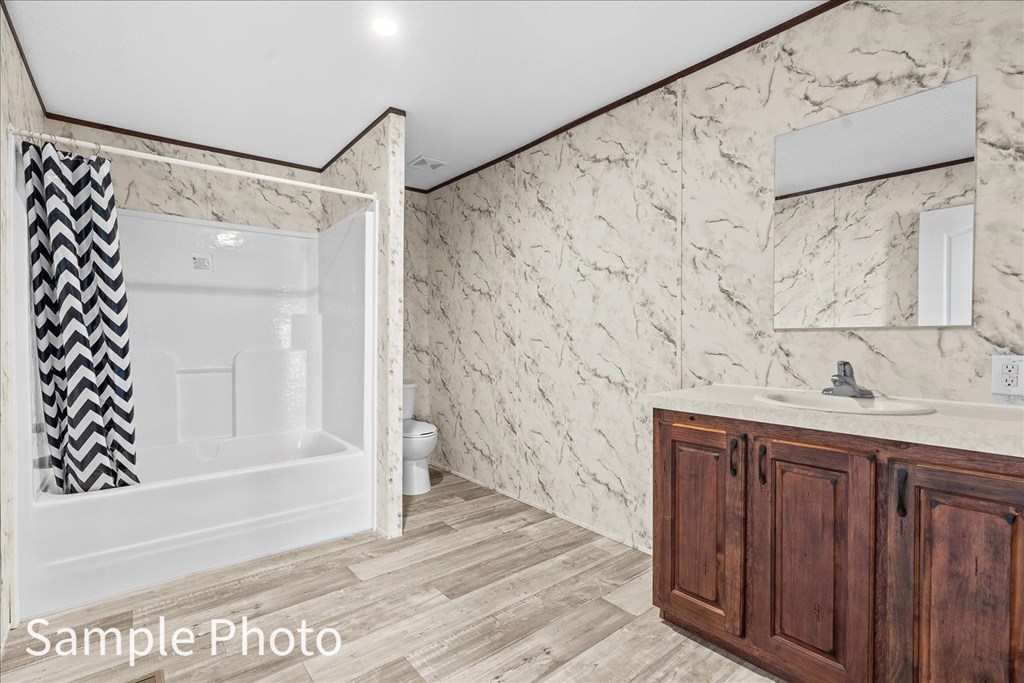 232 Brandon Circle Chatsworth, GA 30705 - Photo 28 of 37 a bathroom with a sink and a mirror