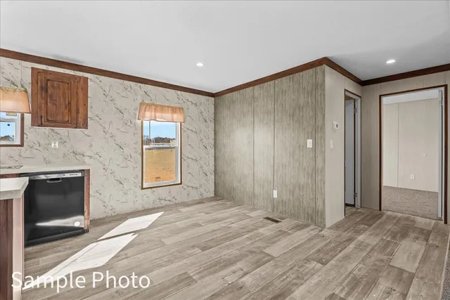 a kitchen with stainless steel appliances a sink and a refrigerator