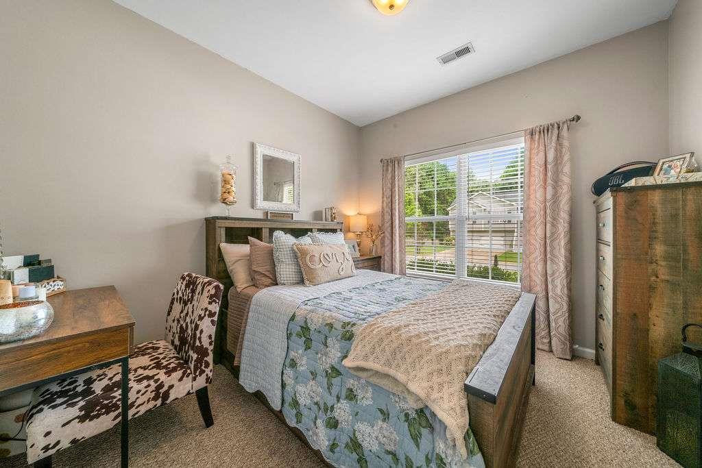 45 Highlander Trail Southwest Rome, GA 30165 - Photo 18 of 32 a bedroom with a bed and large windows
