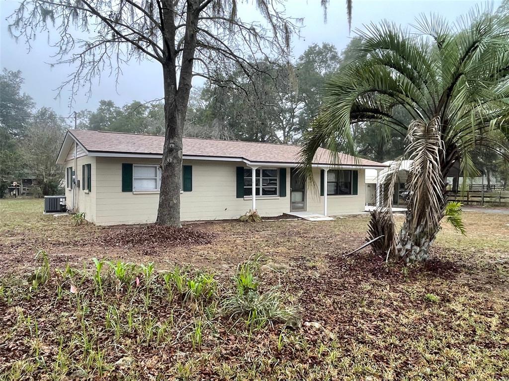 4486 Southwest 159th Court Ocala, FL 34481 - Photo 1 of 21 a backyard of a house with seating space