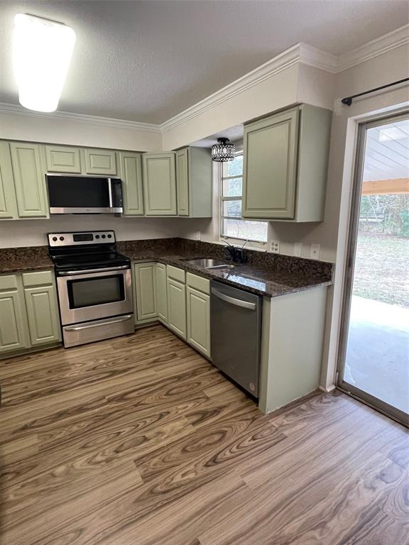 4486 Southwest 159th Court Ocala, FL 34481 - Photo 11 of 21 a kitchen with stainless steel appliances granite countertop a stove a sink and a microwave