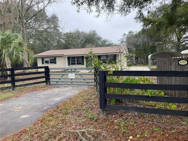 a view of a wooden bench sitting in backyard