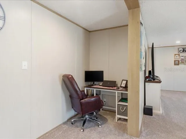 a kitchen with a dining table chairs wooden floor cabinets and stainless steel appliances