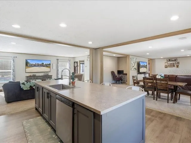 a bed room with furniture and a flat screen tv