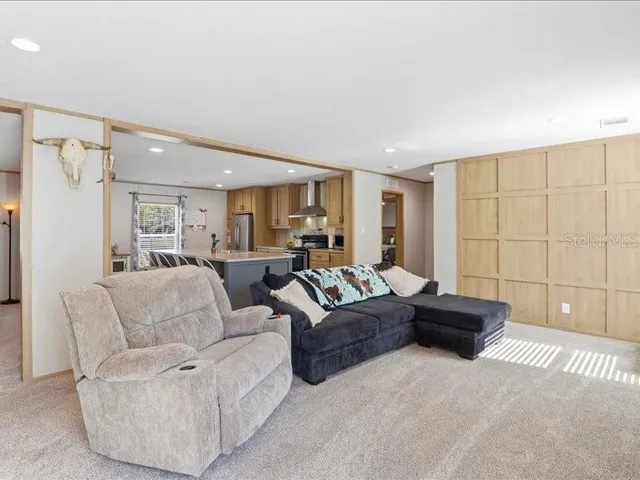 a spacious bedroom with a bed and a cabinets