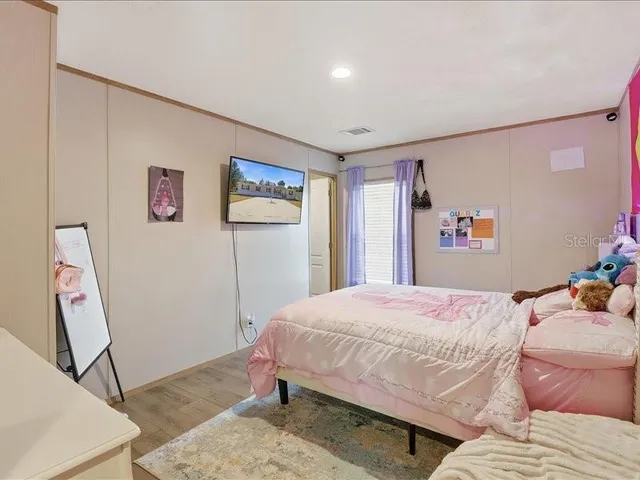 a bedroom with a bed and cabinets