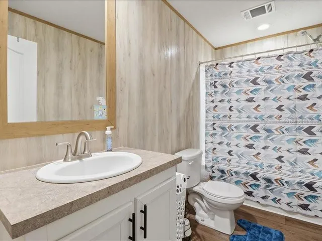 a bathroom with a shower and a shower curtain