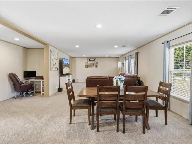 a view of a workspace with furniture