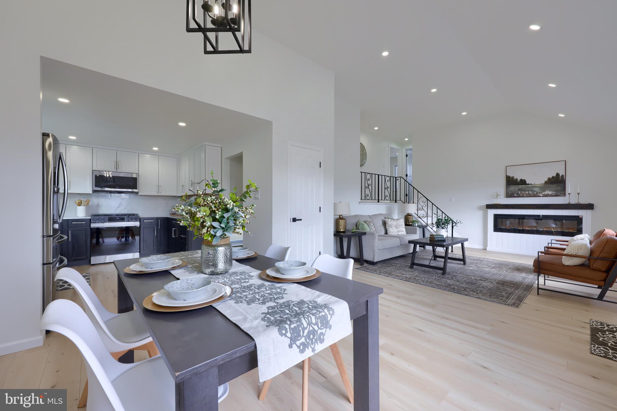 2709 Chapel Road Lancaster, PA 17603 - Photo 16 of 67 a view of a dining room with furniture a rug and wooden floor