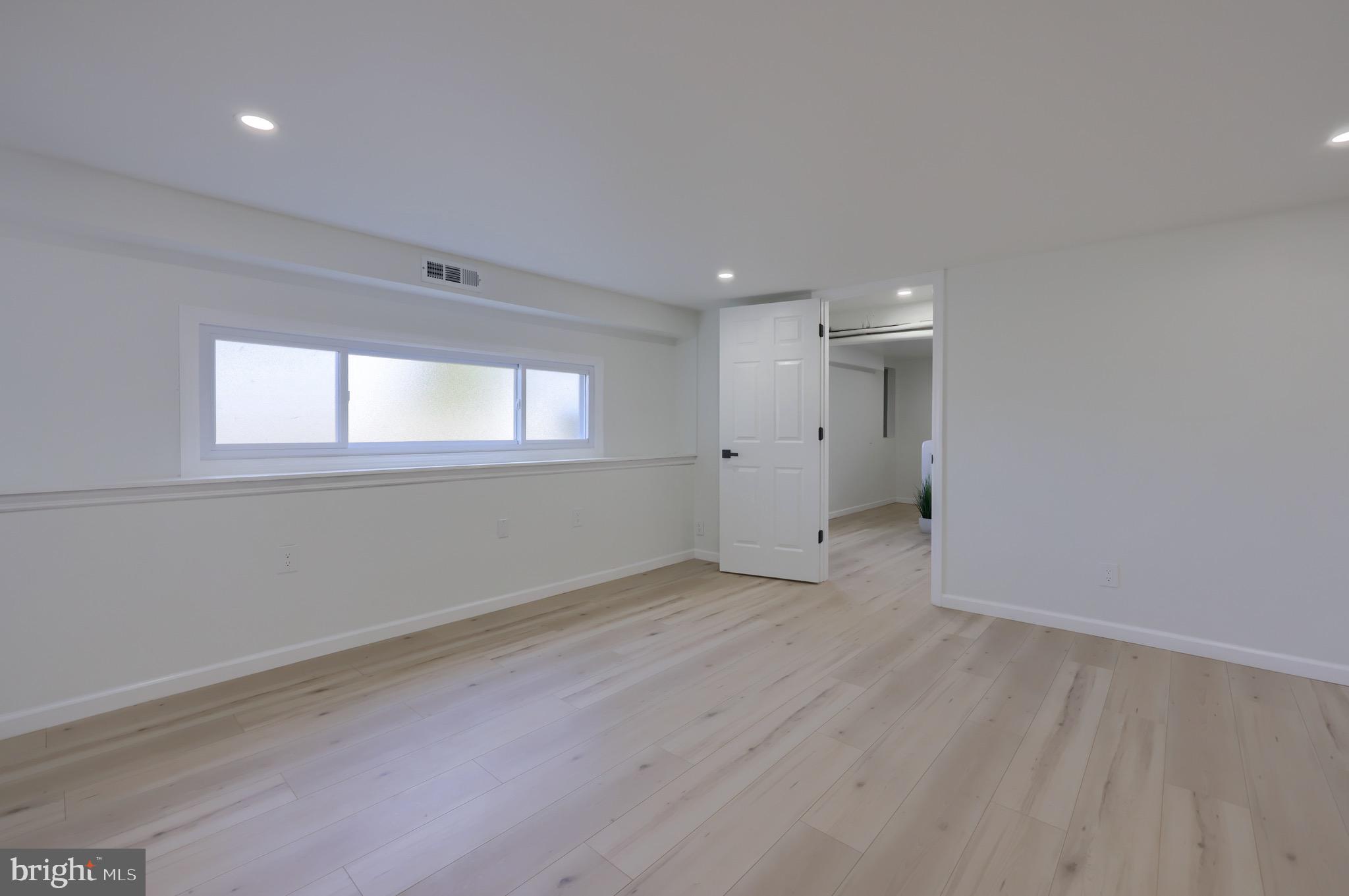 2709 Chapel Road Lancaster, PA 17603 - Photo 49 of 67 an empty room with wooden floor and windows