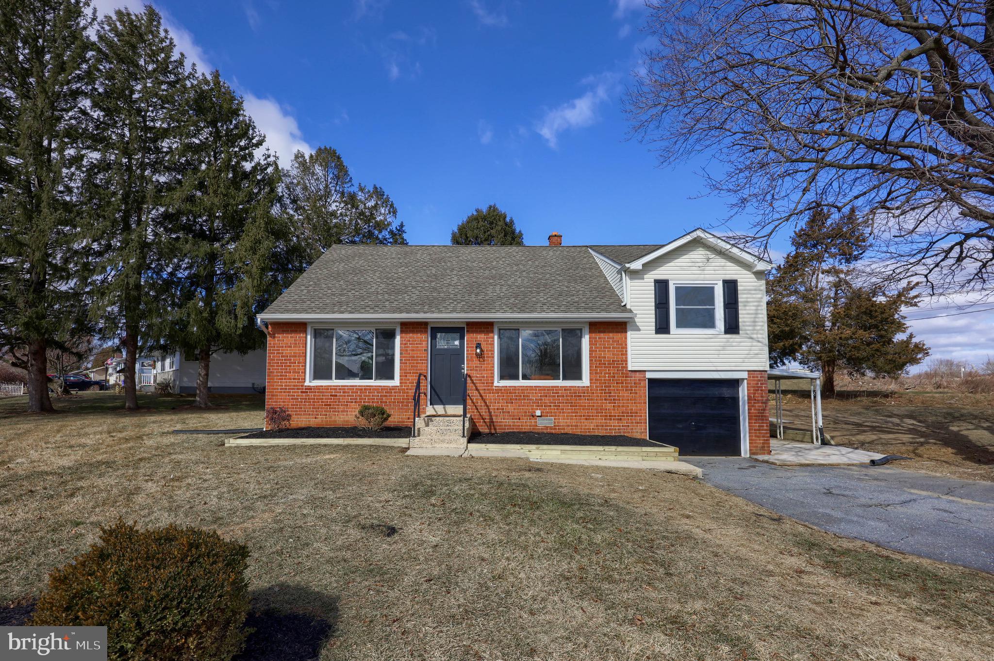 2709 Chapel Road Lancaster, PA 17603 - Photo 55 of 67 a front view of a house with a yard and garage