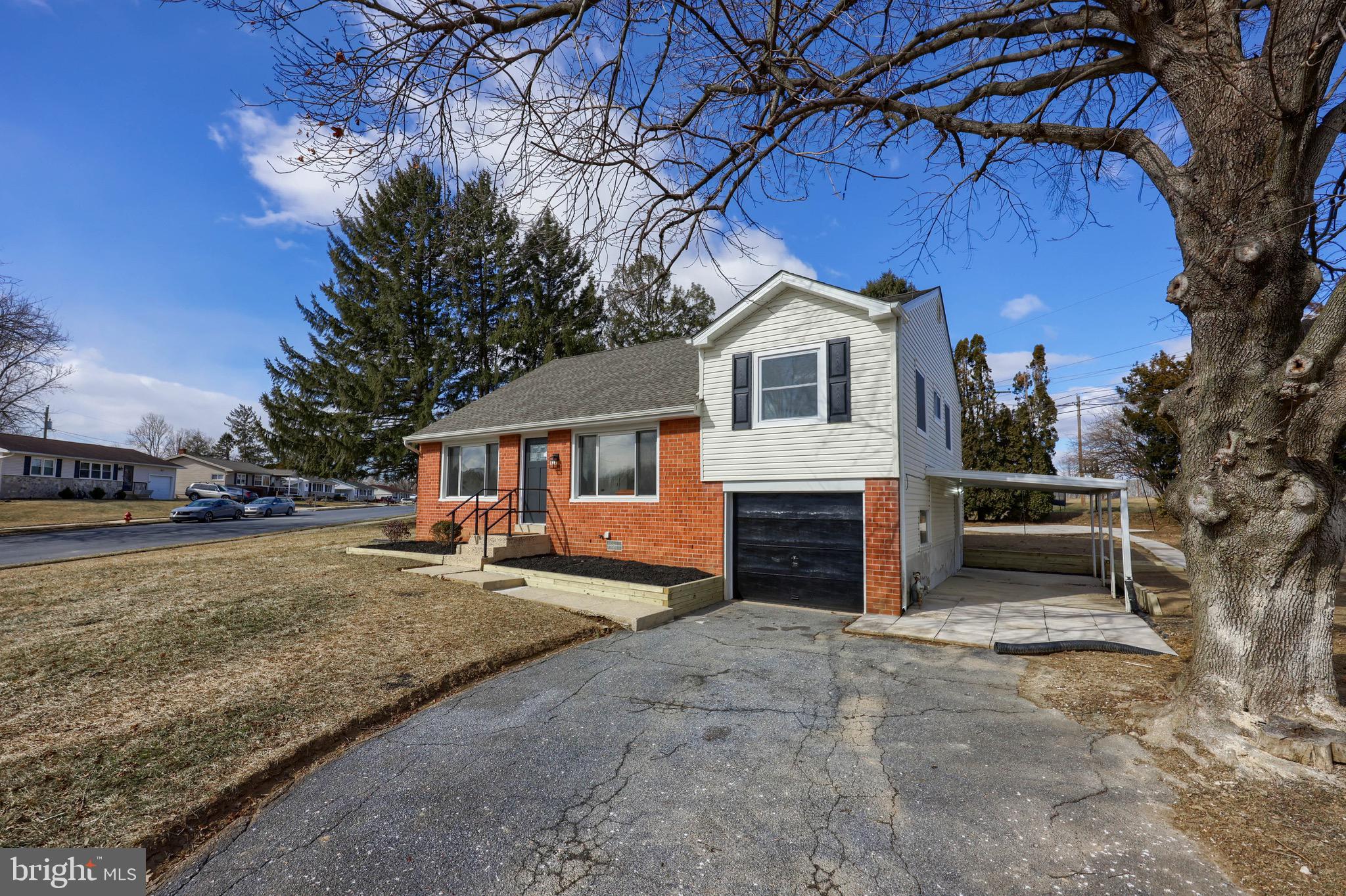 2709 Chapel Road Lancaster, PA 17603 - Photo 56 of 67 a front view of a house with a yard and garage