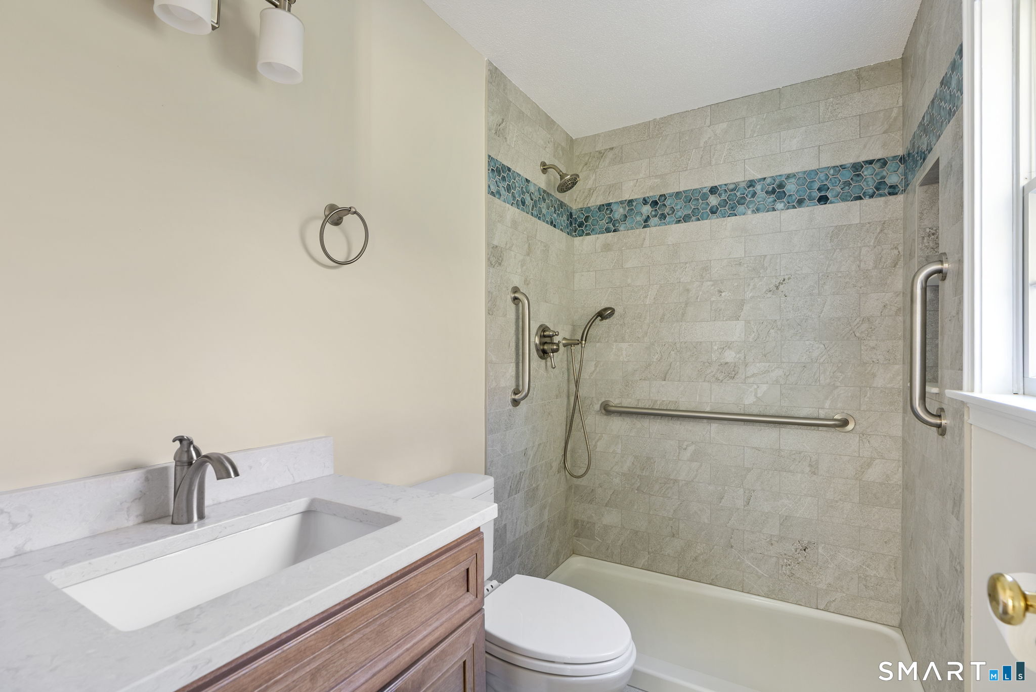 555 Waterville Road Avon, CT 06001 - Photo 27 of 40 a bathroom with a sink a toilet and shower