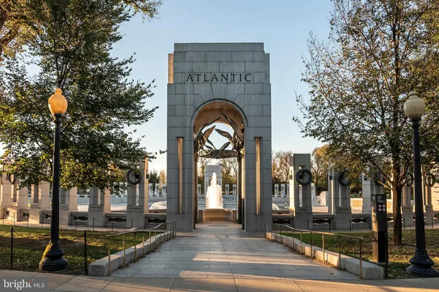 a view of a building and trees in the background