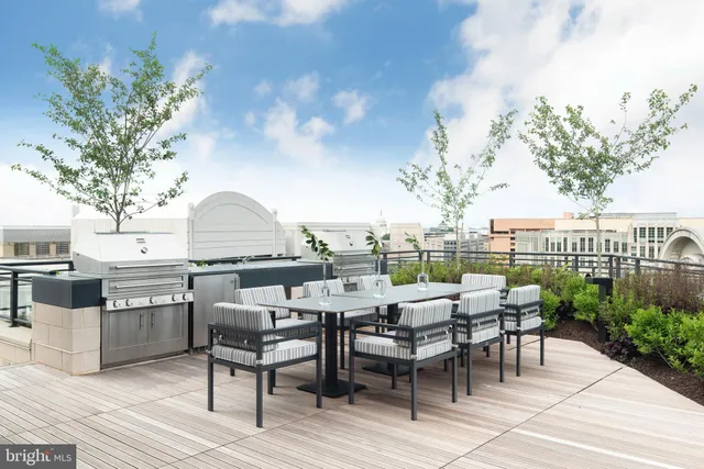 a view of a terrace with furniture and garden