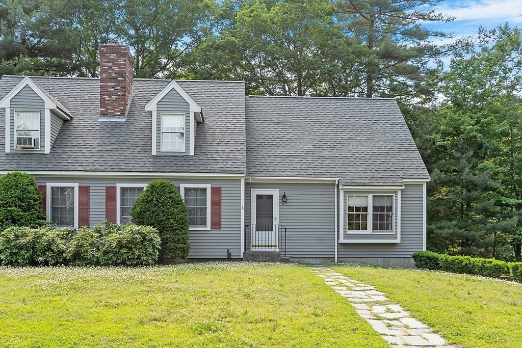 58 Peabody Road, Unit B Shirley, MA 01464 - Photo 1 of 38 a view of a house with a swimming pool