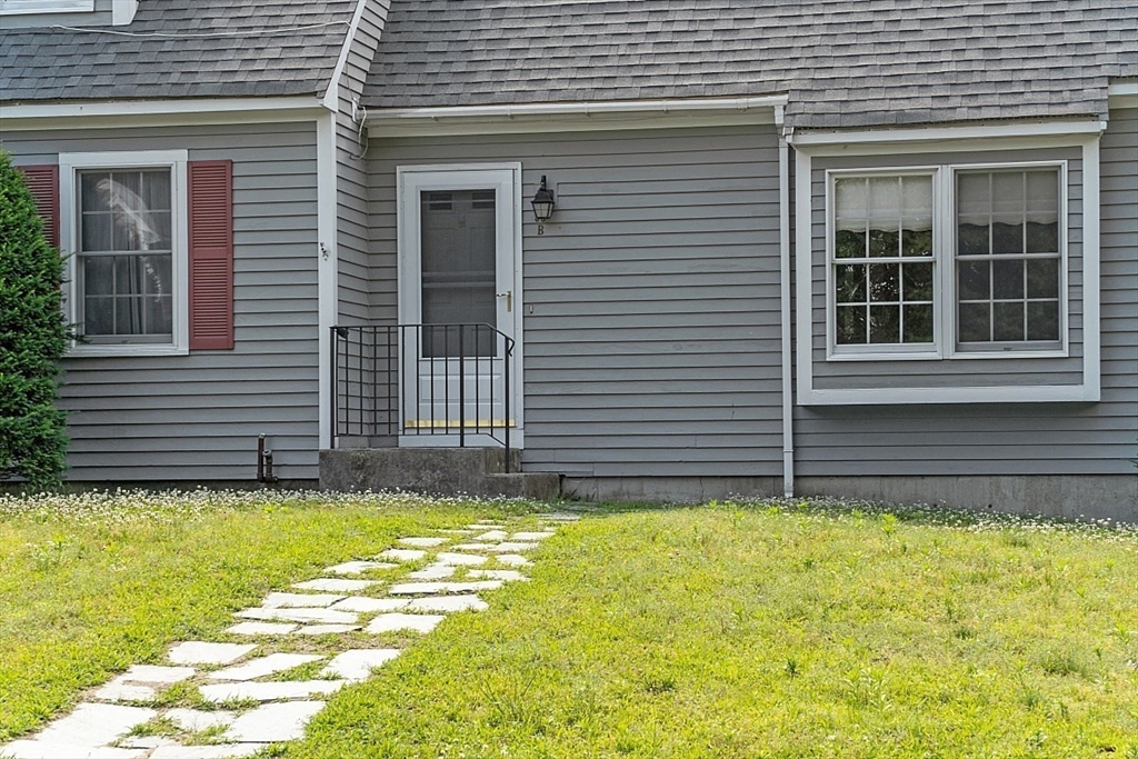 58 Peabody Road, Unit B Shirley, MA 01464 - Photo 2 of 38 a view of a house with a yard